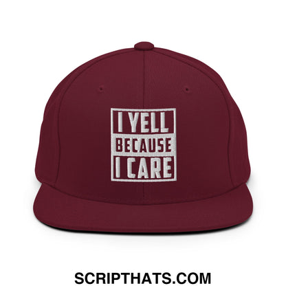 Maroon embroidered flat bill snapback hat with white text i yell because i care in a boxed design
