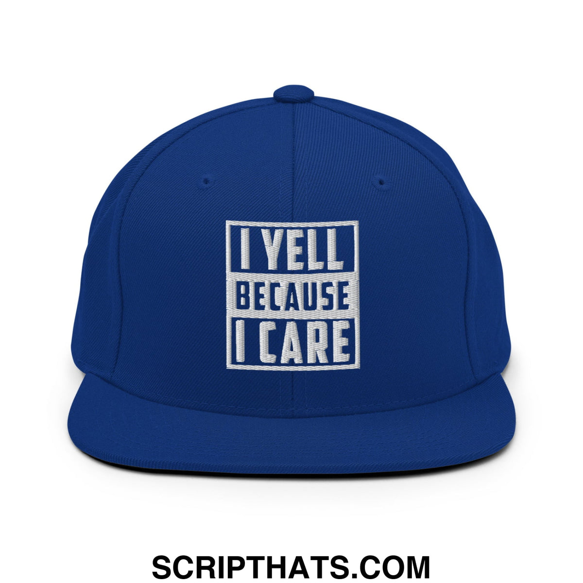 Royal blue snapback hat with white embroidered i yell because i care text in bold block font and flat bill brim