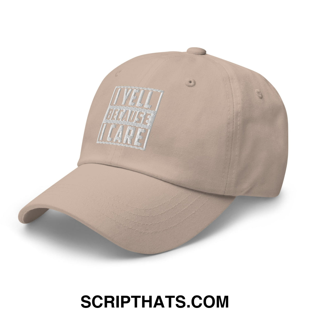 Beige unstructured dad hat with white embroidered i yell because i care text in a rectangular design