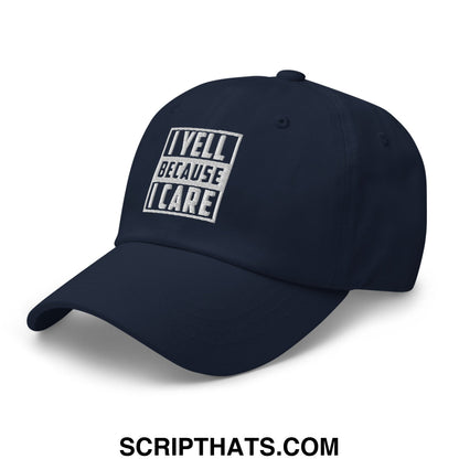 Navy blue unstructured dad hat with white embroidered bold text i yell because i care on the front panel