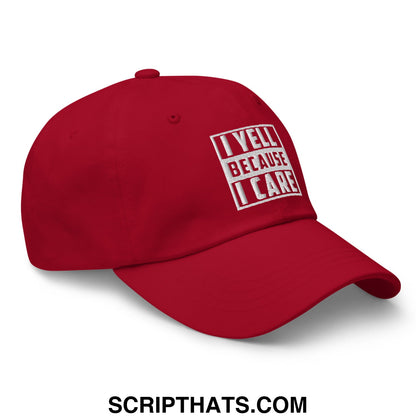 Red unstructured dad hat with white embroidered text i yell because i care in blocky font