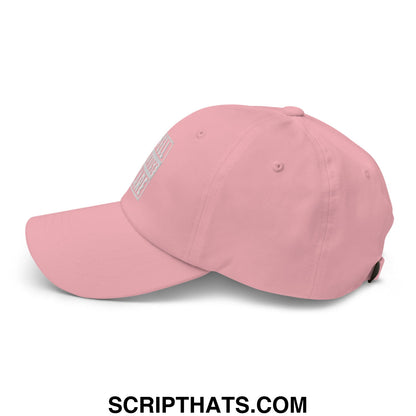 A soft pink i yell because i care embroidered unstructured dad hat with a subtle logo on the side