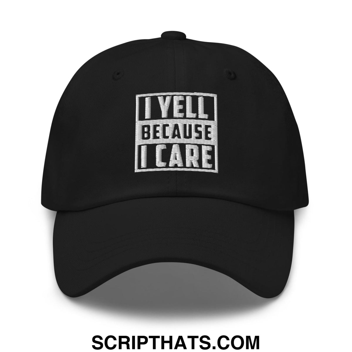 Black unstructured dad hat with white embroidered text i yell because i care in bold blocky font