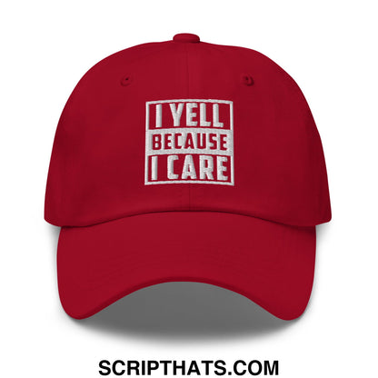 Red unstructured dad hat with white embroidered text i yell because i care in a rectangular box design