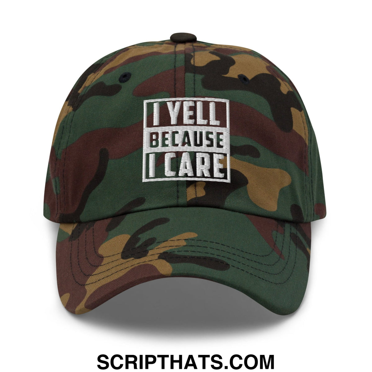 A camouflage-patterned unstructured dad hat with a white embroidered patch reading i yell because i care