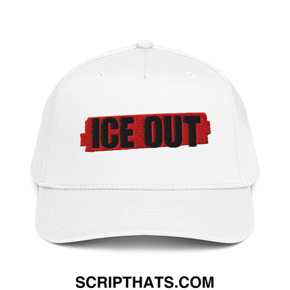 White baseball snapback hat with bold black ice out embroidery on red textured background