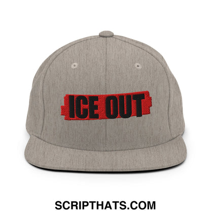 Gray heather snapback cap with a flat bill brim featuring black ice out embroidery on a red rectangular patch