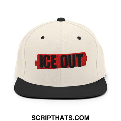 Cream-colored ice out embroidered flat bill snapback hat with black brim and bold red and black logo