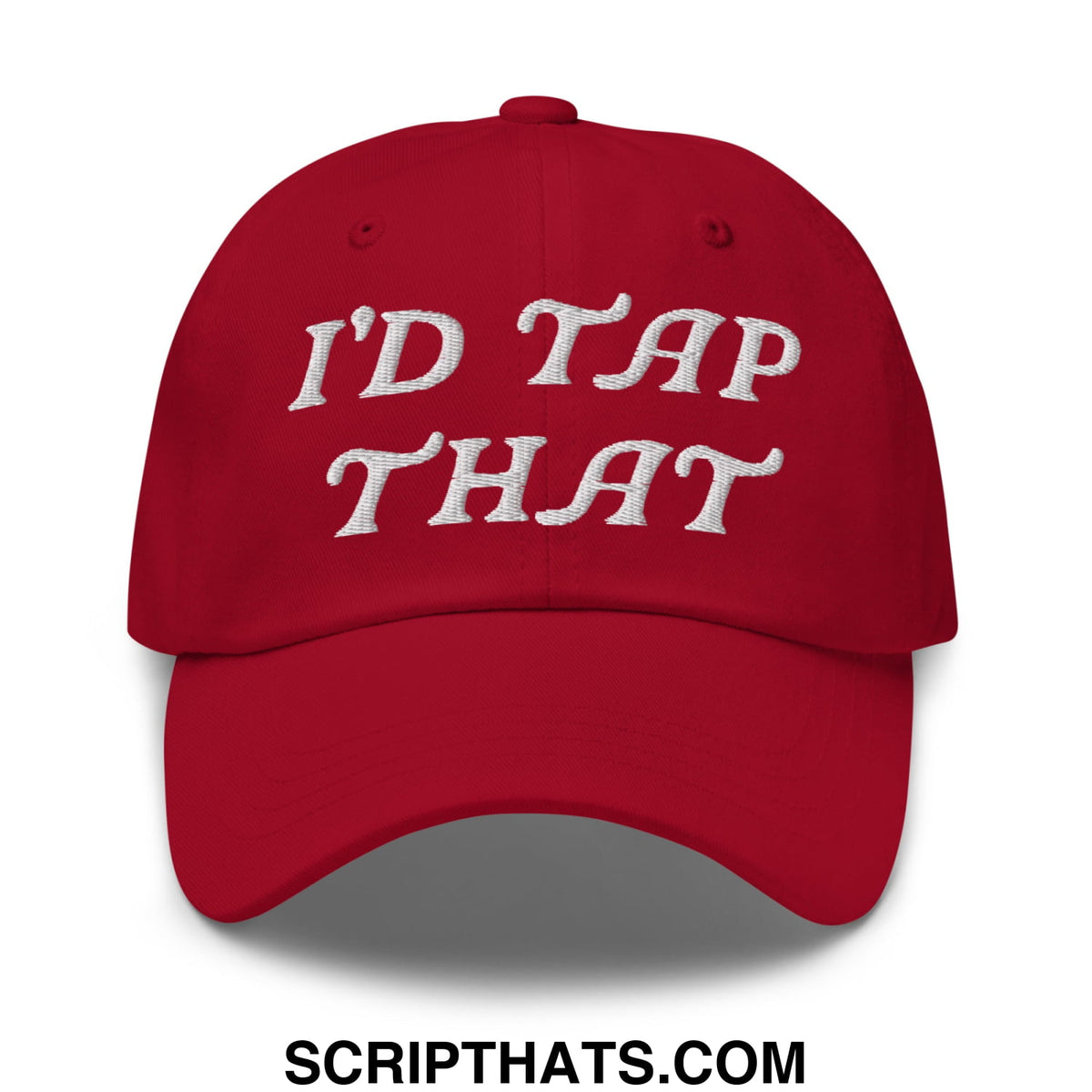 A red unstructured golf dad hat with white embroidered text reading idd tap that on the front