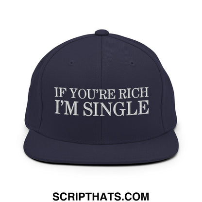 Navy blue snapback cap with white embroidered text if youre rich im single featuring a flat bill brim design