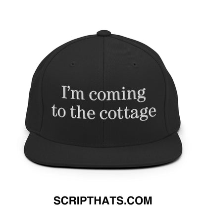 Black snapback cap with white embroidered text im coming to the cottage flat bill brim design