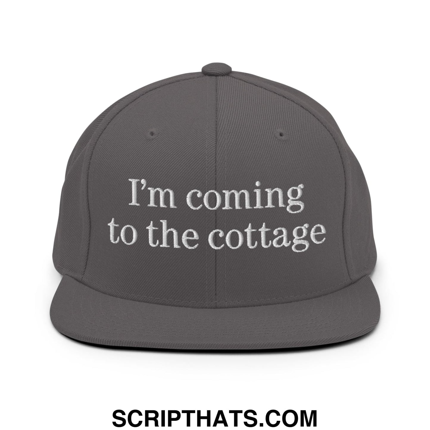 Gray snapback cap with white embroidered text reading im coming to the cottage on flat bill brim