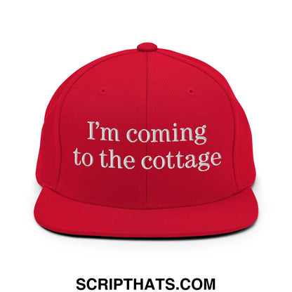 Red snapback cap with white embroidered text i’m coming to the cottage flat bill brim design