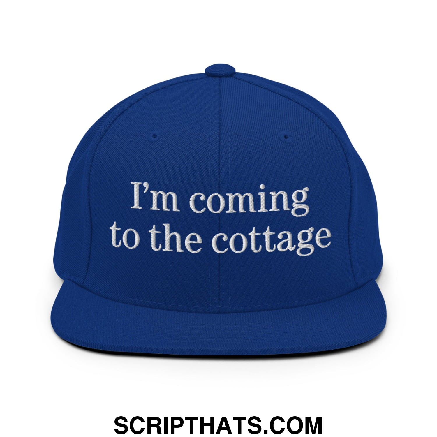 Royal blue snapback flat bill brim hat with white embroidered text I’m coming to the cottage