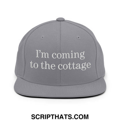 Gray snapback hat with white embroidered text reading im coming to the cottage flat bill brim style