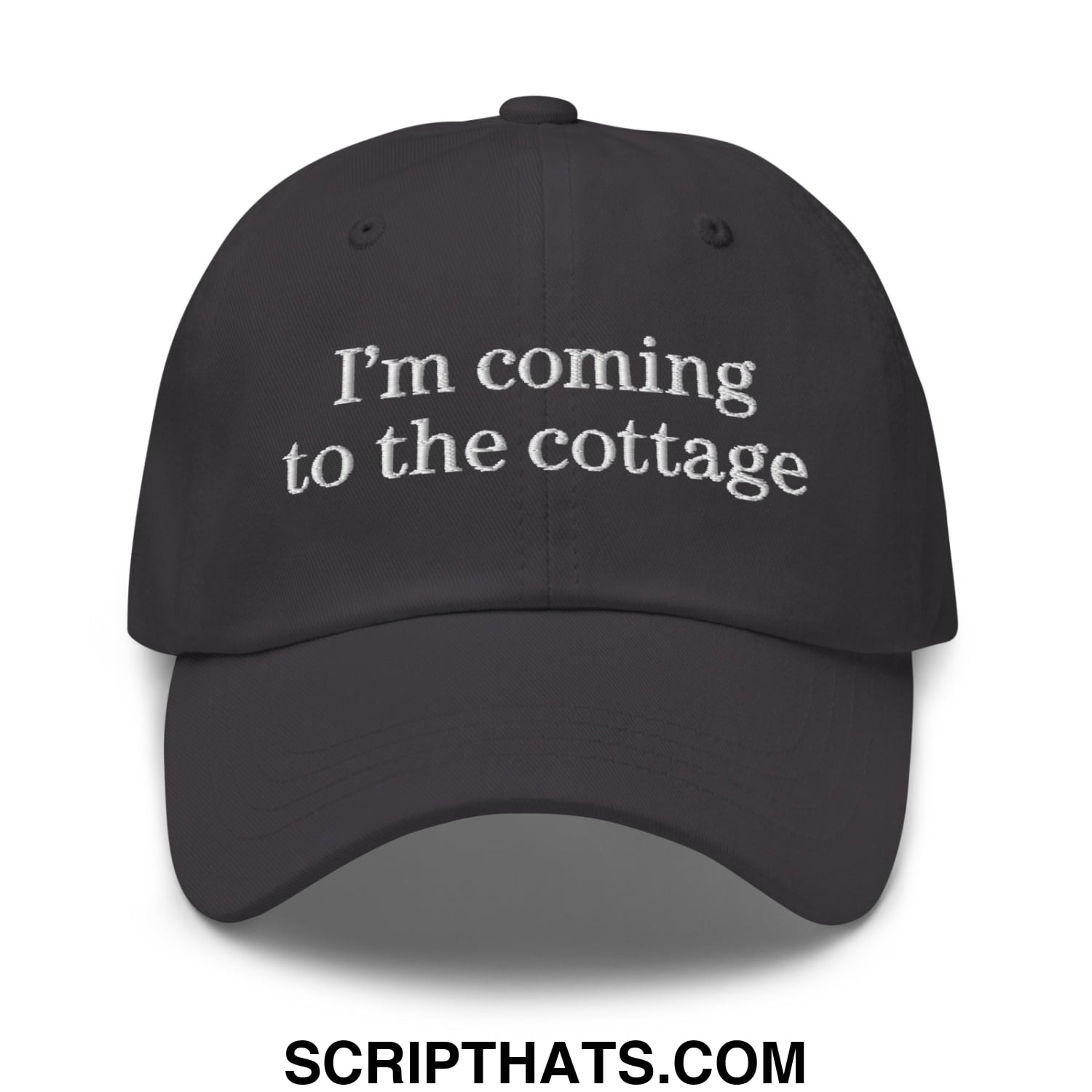 Black unstructured dad hat with white embroidered text im coming to the cottage ideal for casual outdoor wear