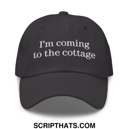 Black unstructured dad hat with white embroidered text im coming to the cottage ideal for casual outdoor wear
