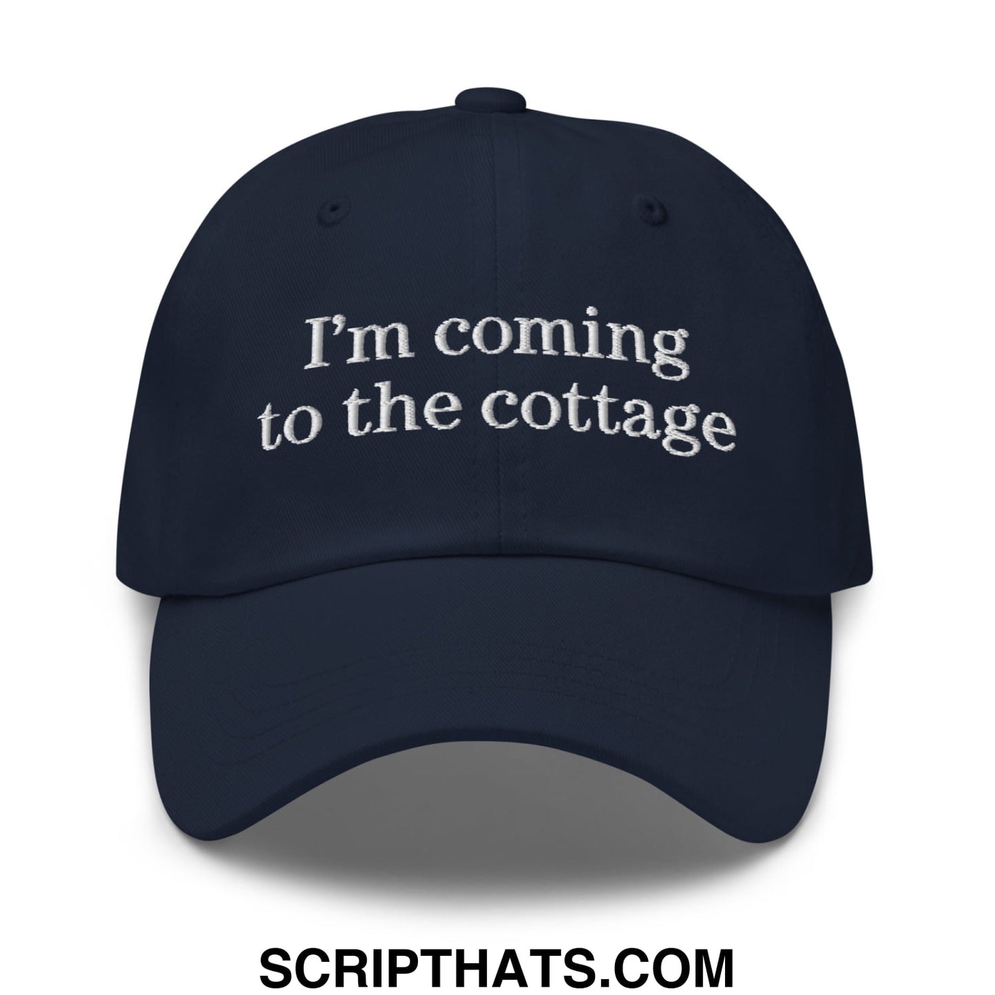 Navy blue unstructured dad hat with white embroidered text i’m coming to the cottage for casual outdoor wear