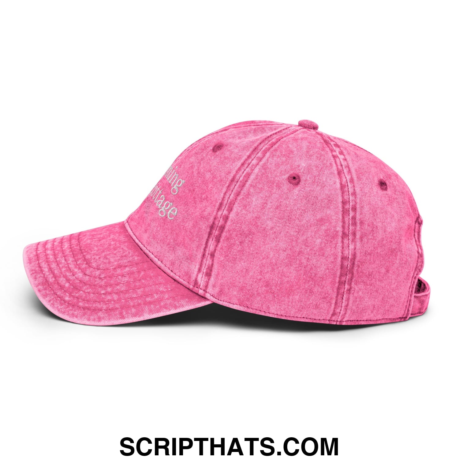 A faded pink unstructured denim dad hat with white embroidered text I’m Coming to the Cottage on the front