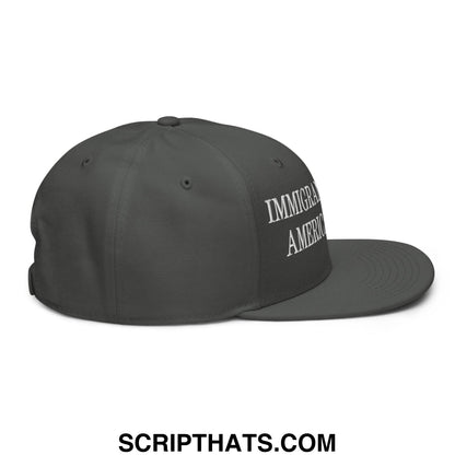 Dark gray snapback cap with white embroidered immigrant america text and flat brim for casual wear