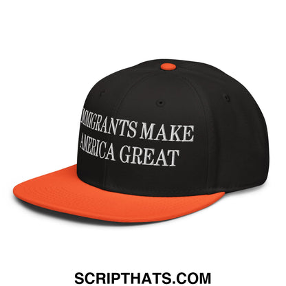 Black and orange snapback cap with white embroidered text reading immigrants make america great on front bill