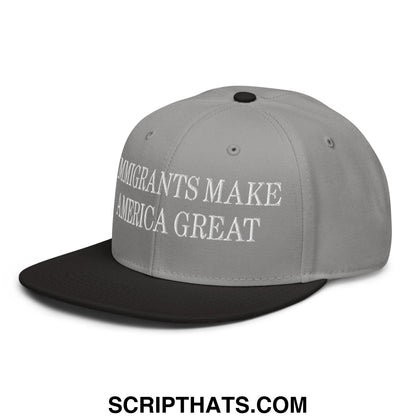 Gray and black snapback hat with white embroidered immigrants make america great text on flat brim bill