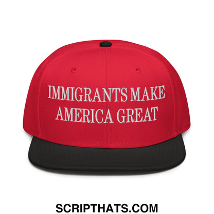 Red and black snapback cap with white embroidered text reading immigrants make america great on front flat brim bill