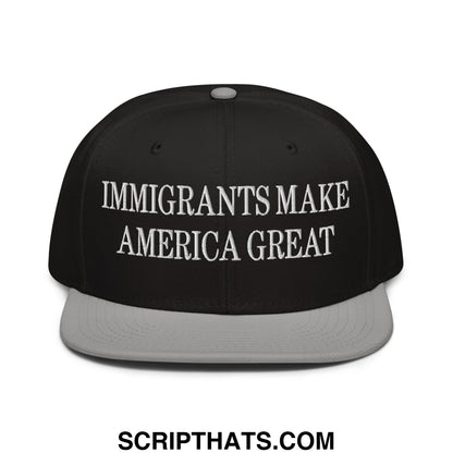 Black snapback cap with gray brim and white embroidered text reading immigrants make america great on front panel