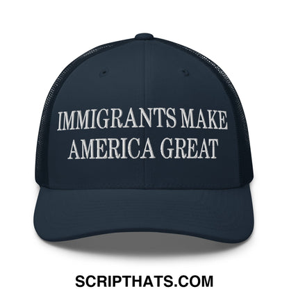 Dark blue mesh trucker hat with white embroidered text immigrants make america great on the front panel