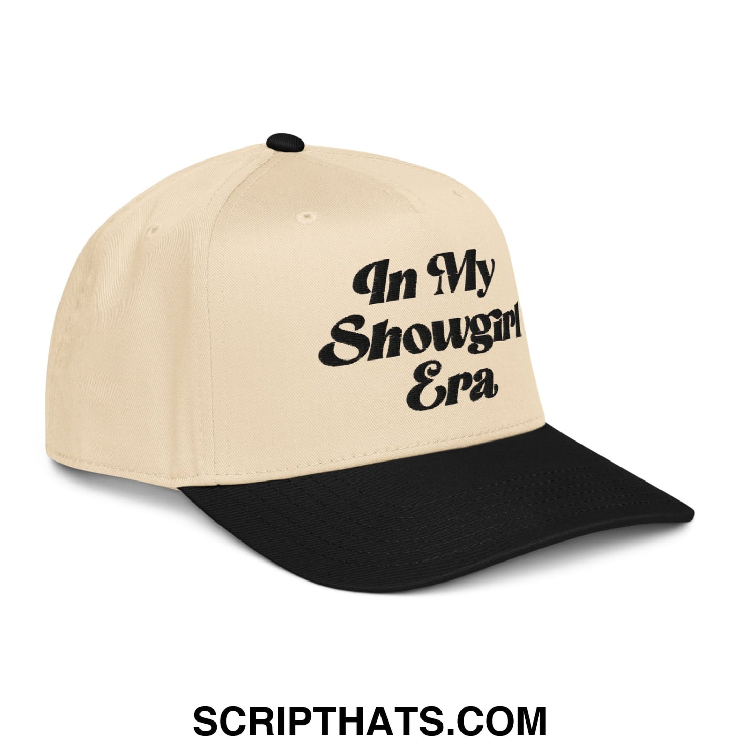 Beige and black embroidered baseball snapback hat with in my showgirl era bold black script on front