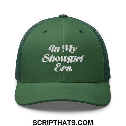Dark green mesh trucker hat with white embroidered text reading in my showgirl era on front panel