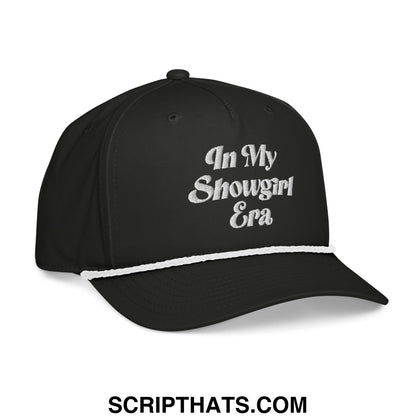 Black embroidered rope baseball cap with white in my showgirl era text and contrasting white brim stripe
