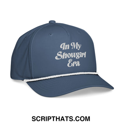 Navy blue baseball cap with white embroidered in my showgirl era text and white contrasting brim stripe rope hat