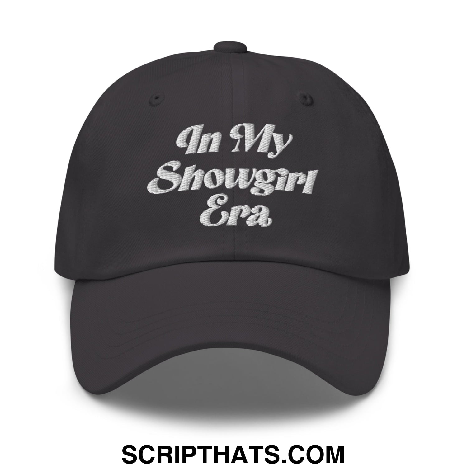 Black unstructured dad hat with white embroidered text reading in my showgirl era on the front panel