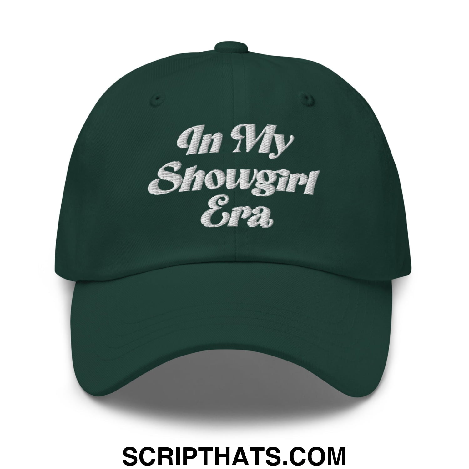 Dark green unstructured dad hat with white embroidered text in my showgirl era on the front panel
