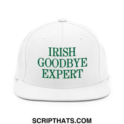 White snapback cap with green embroidered irish goodbye expert text featuring a flat bill brim design