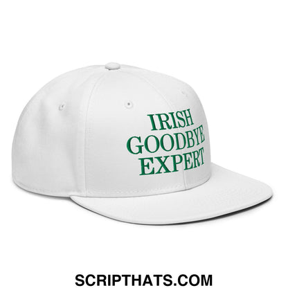 White snapback hat with green embroidered irish goodbye expert text on the front flat brim bill