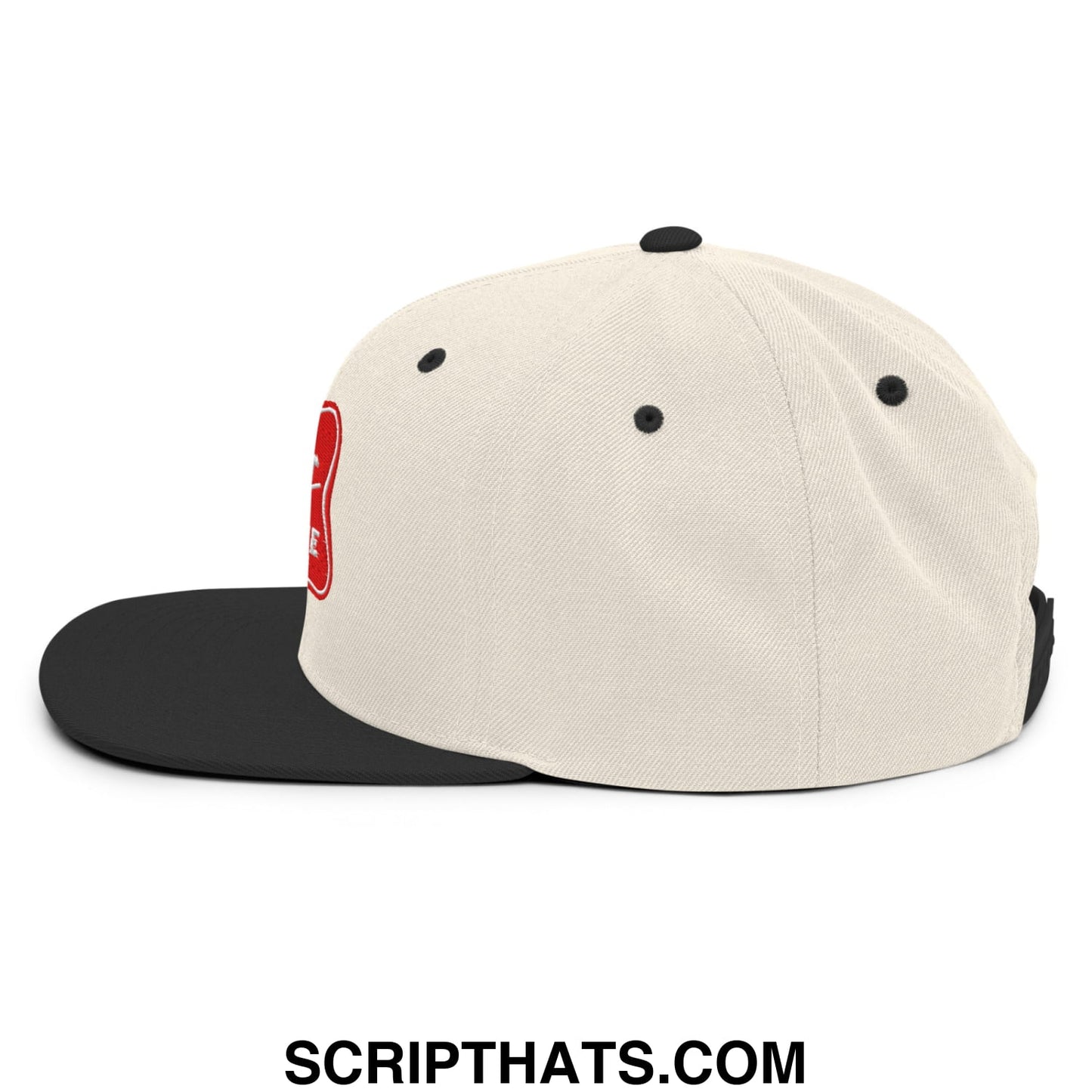 Cream-colored snapback cap with a black flat bill and red embroidered logo from it’s baker time collection