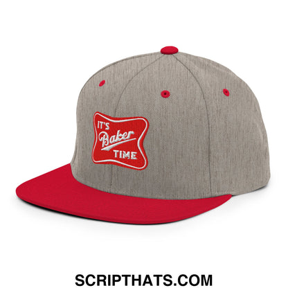 Gray and red flat bill brim snapback hat with it’s baker time embroidered patch and adjustable closure