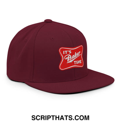 Maroon it’s baker time embroidered flat bill brim snapback hat with a red patch and white script detailing