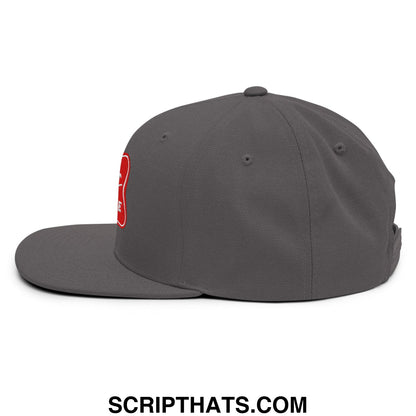 Dark gray snapback cap with red embroidered logo on the side from the It’s Baker Time flat bill brim hat collection