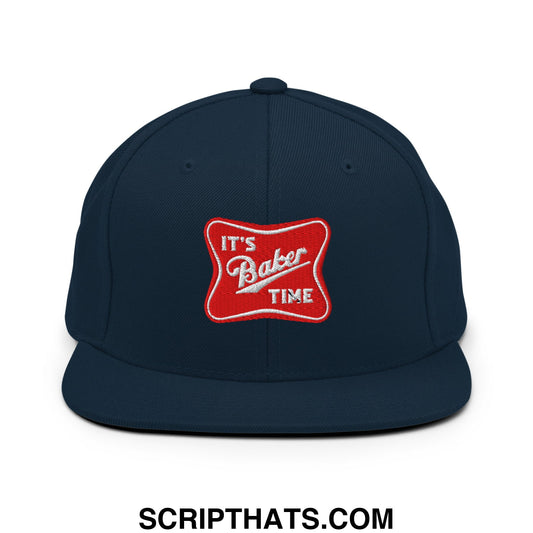 Navy blue snapback cap with flat bill brim featuring a red embroidered patch reading its baker time
