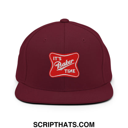 Maroon snapback hat with flat bill and red embroidered patch reading its baker time in white script
