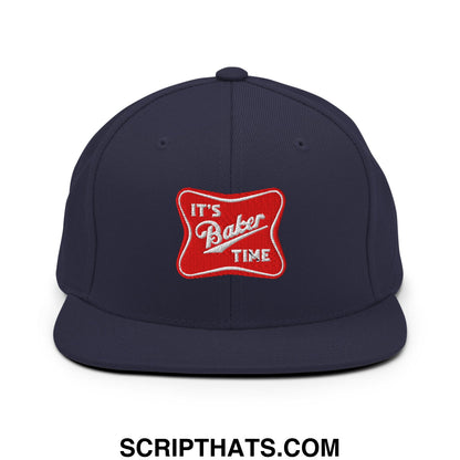 Navy blue snapback hat with a flat bill featuring a red embroidered patch reading its baker time