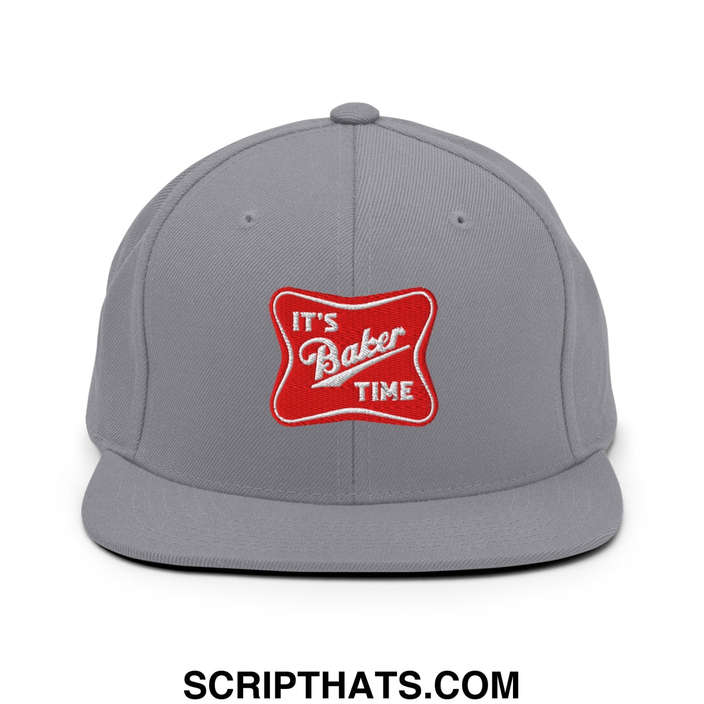 Gray snapback cap with a flat bill featuring a red embroidered patch with white text reading it’s baker time