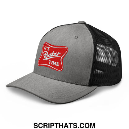 Gray and black mesh trucker hat with a red embroidered patch reading its baker time on the front