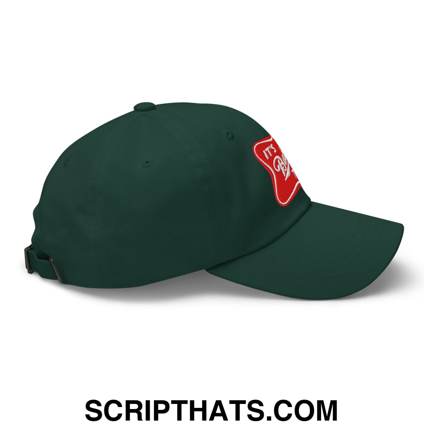 Dark green unstructured dad hat with red embroidered patch and white script text side detail titled its baker time