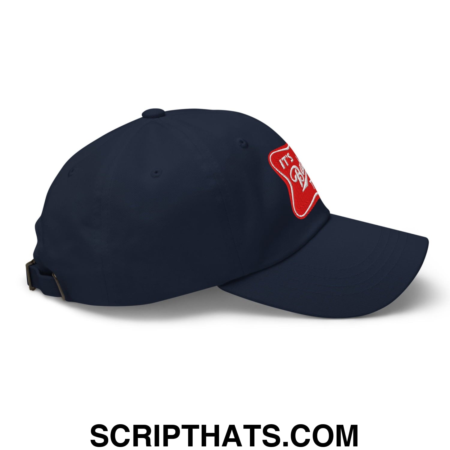 Navy blue unstructured dad hat with red embroidered patch on the side from it’s baker time collection