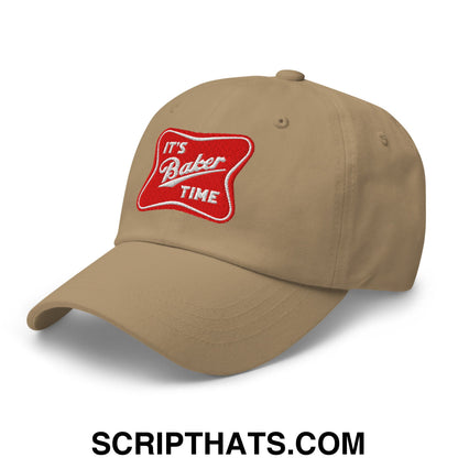 Beige unstructured dad hat with red embroidered patch and white cursive text reading its baker time
