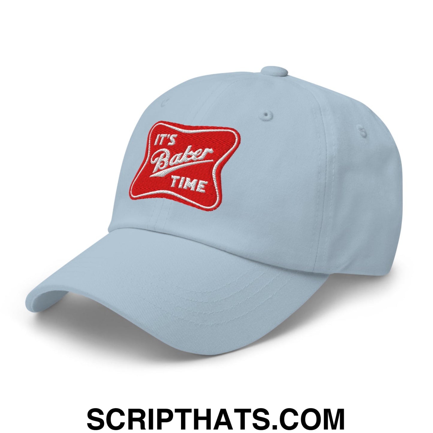 Light blue unstructured dad hat featuring red embroidered patch with white its baker time script text